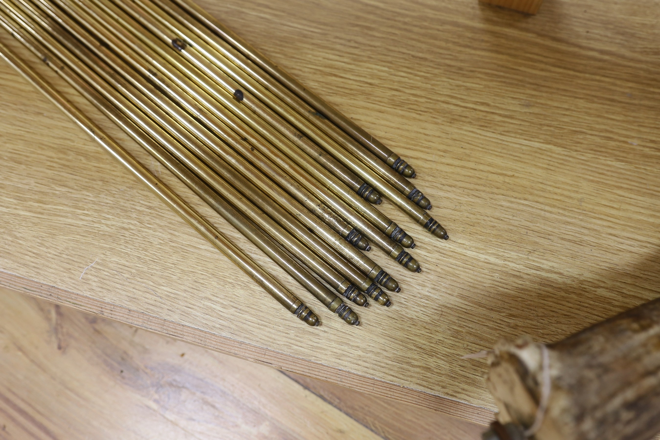 A set of twelve brass stair rods